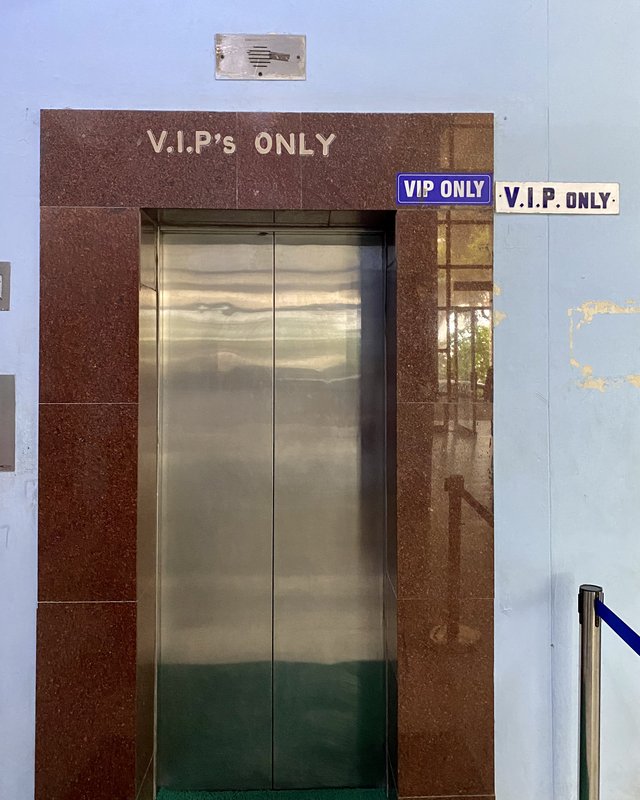 Elevator with three signs reading VIP only